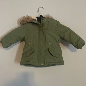 green winter coat with lined inside and fuzzy hood